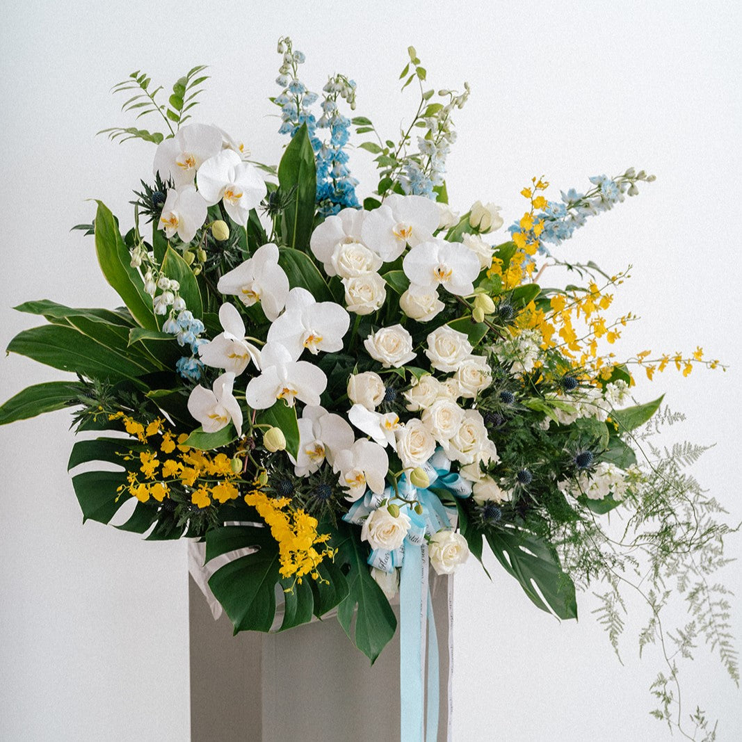 Lush Delphinium and Orchid Floral Stand